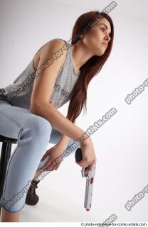 16 2020 MOLLY SITTING POSE WITH GUN 2